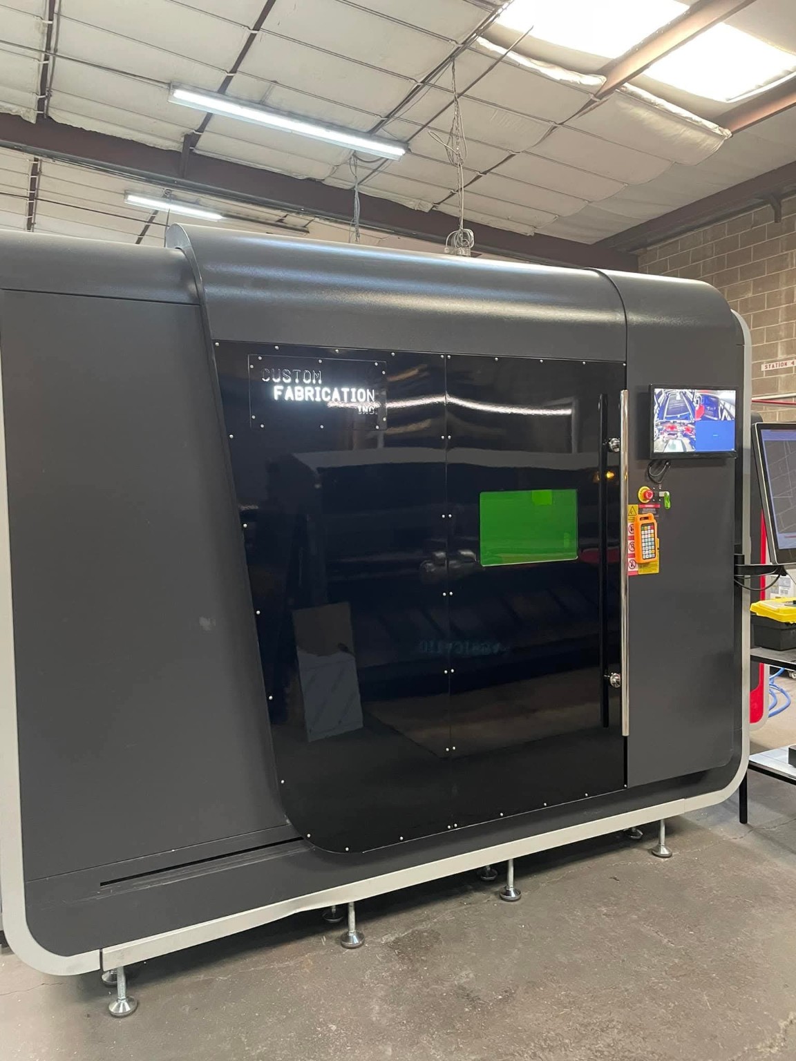 Large laser cutting machine inside the Custom Fabrication shop