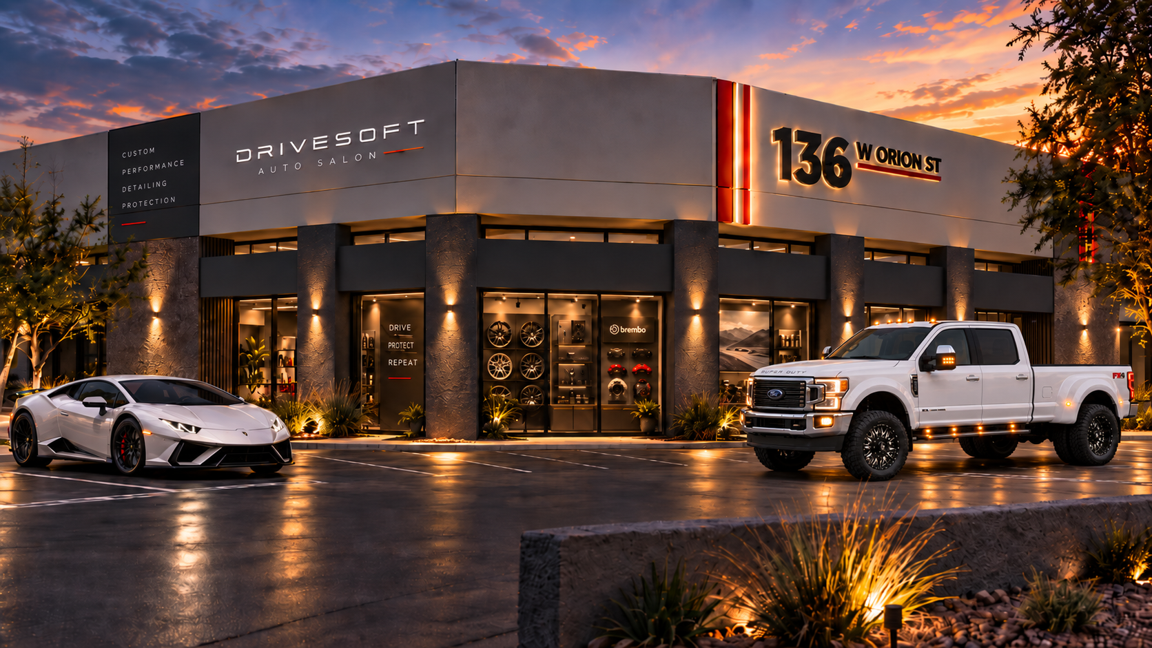 Auto Salon concept visualization of the Drivesoft building at dusk with a white Lamborghini and Ford truck